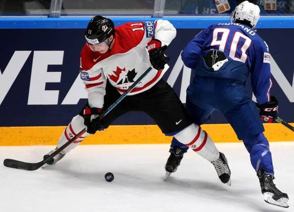 ST. PETERSBURG, RUSSIA. MAY 16, 2016. France s Maxime Moisand (R) and Canada s Brendan Gallagher fight for the puck in their 2016 IIHF World Championship WM Weltmeisterschaft Preliminary Round Group B Ice hockey Eishockey match at Yubileyny Sports Palace. The Canadian Team won the game 4:0. Alexander Demianchuk TASS  TS0233D0