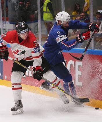 ST. PETERSBURG, RUSSIA. MAY 16, 2016. Canada s Boone Jenner (L) and France s Jonathan Janil fight for the puck in their 2016 IIHF World Championship WM Weltmeisterschaft Preliminary Round Group B Ice hockey Eishockey match at Yubileyny Sports Palace. The Canadian Team won the game 4:0. Sergei Savostyanov TASS  TS0233EA