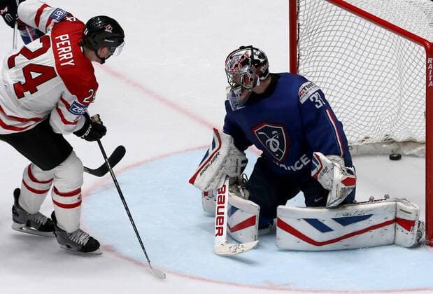 ST. PETERSBURG, RUSSIA. MAY 16, 2016. Canada s Corey Perry (L) and France s goalie Ronan Quemener in action in their 2016 IIHF World Championship WM Weltmeisterschaft Preliminary Round Group B Ice hockey Eishockey match at Yubileyny Sports Palace. The Canadian Team won the game 4:0. Alexander Demianchuk TASS  TS0233F0