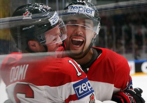 Canada s Max Domi (L) and Matt Dumba celebrate scoring in their 2016 IIHF World Championship WM Weltmeisterschaft quarter-final Ice hockey Eishockey match against Sweden at the Yubileyny Sports Palace in St. Petersburg, Russia, May 19, 2016. Sergei Savostyanov TASS  TS023C67