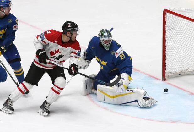 Canada s Taylor Hall (L) attacks Sweden s goaltender Jacob Markstrom in their 2016 IIHF World Championship WM Weltmeisterschaft quarter-final Ice hockey Eishockey match at the Yubileyny Sports Palace in St. Petersburg, Russia, May 19, 2016. Alexander Demianchuk TASS  TS023C7D