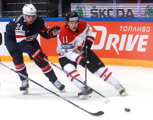 US Auston Matthews (L) and Canada s Brendan Gallagher fight for the puck in their 2016 IIHF World Championship WM Weltmeisterschaft semifinal Ice hockey Eishockey match at VTB Ice Palace in Moscow, Russia, May 21, 2016. Sergei Fadeichev TASS  TS023F9E