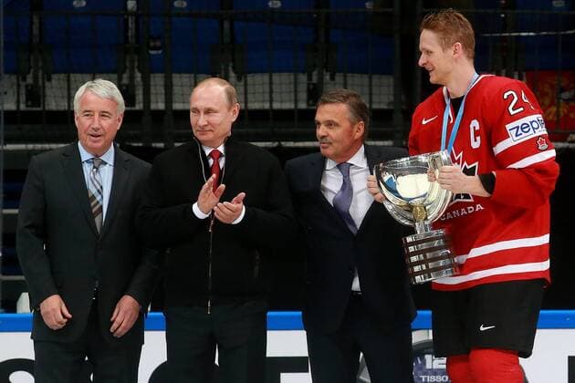 Bob Nicholson, vice president of the International Ice hockey Eishockey Federation (IIHF), Russia s President Vladimir Putin, Rene Fasel, president of the International Ice Hockey Federation (IIHF), and Canada s Corey Perry (L-R) during an awards ceremony following the 2016 IIHF World Championship WM Weltmeisterschaft final ice hockey match between Finland and Canada at VTB Ice Palace in Moscow, Russia, May 22, 2016. The Canadian team won the game 2:0. Sergei Fadeichev TASS  TS024233