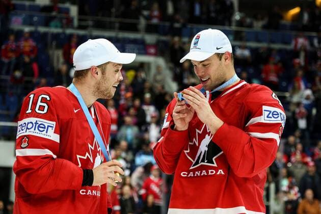 (160523) -- MOSCOW, May 22, 2016 -- Max Domi (L) and Taylor Hall (R) of Canada react during the award ceremony of IIHF Ice hockey Eishockey World Championship WM Weltmeisterschaft in Moscow, Russia, on May 22, 2016. Canada won 2-0 and claimed the title. ) (SP)RUSSIA-MOSCOW-ICE HOCKEY-FINAL EvgenyxSinitsyn 