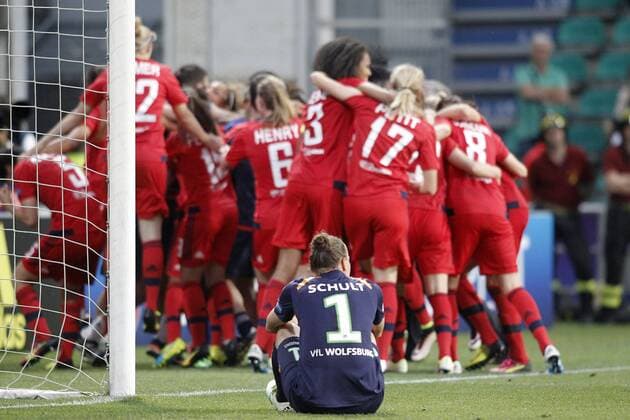 Olympique Lyonnais s team celebrate the victory in the UEFA Women s Champions League 2015 2016 Final match in presence of VfL Wolfsburg s Almuth Schult dejected.May 26,2016.  (2016052615)