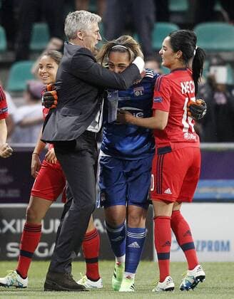 Olympique Lyonnais s coach Gerard Precheur (l) and the players Sarah Bouhaddi and Louisa Necib celebrate the victory in the UEFA Women s Champions League 2015 2016 Final match.May 26,2016.  (2016052618)