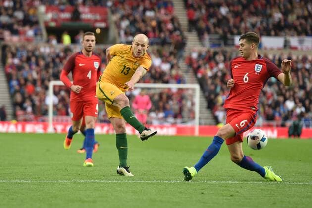 27.05.2016. Stadium of Light, Sunderland, England. International Friendly LÃ¤nderspiel England versus Australia. Aaron Mooy of Australia shoots towards goal past John Stones of England xPeterxHaygarthx  ActionPlus11742297
