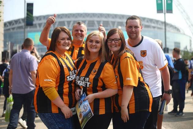 Hull fans arrive during the Skybet Championship Play Off Final match at Wembley Stadium. Championship, Hull City vs. Sheffield Wednesday EDITORIAL USE ONLY. No use with unauthorised audio, video, data, fixture lists, club league logos or live services. Online in-match use limited to 120 images, no video emulation. No use in betting, games or single club league player publications.
