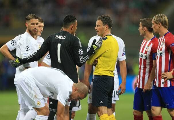 Naval of real Madrid protests to referee Mark Clattenburg following his awarding of a penalty during the UEFA Champions League Final match at the Giuseppe Meazza Stadium, Milan, Italy. Photo credit should read: David Klein Sportimage EDITORIAL USE ONLY. No use with unauthorised audio, video, data, fixture lists, club league logos or live services. Online in-match use limited to 120 images, no video emulation. No use in betting, games or single club league player publications.
