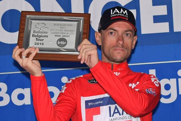 Belgian Dries Devenyns of IAM Cycling celebrates in the red jersey of leader in the overall ranking after the final stage of the Baloise Belgium Tour cycling race, 174,2km from Tremelo to Tongeren, on Sunday 29 May 2016. DAVIDxSTOCKMAN  x04861268x