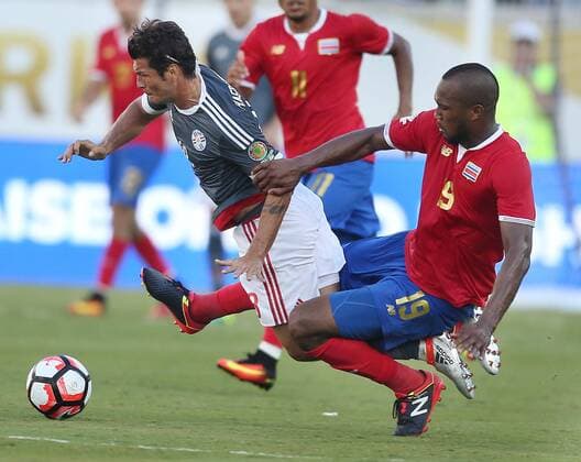 June 4, 2016 - Orlando, FL, USA - Costa Rica s Kendall Waston, right, is issued a red card for this play as he kicks Paraguay s Nelson Haedo Valdez during the start of pool play in the Copa America at Camping World Stadium in Orlando, Fla., on Saturday, June 4, 2016. The teams tied, 0-0. Copa America: Costa Rica vs. Paraguay - ZUMAm67_