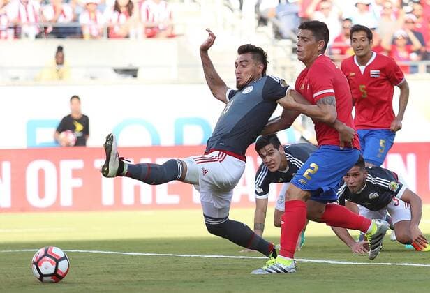 June 4, 2016 - Orlando, FL, USA - Costa Rica s Johnny Acosta (2) grabs the arm of Paraguay s Dario Lezcano (19) as Lezcano tries to put a shot on goal during the start of pool play in the Copa America at Camping World Stadium in Orlando, Fla., on Saturday, June 4, 2016. The teams tied, 0-0. Copa America: Costa Rica vs. Paraguay - ZUMAm67_