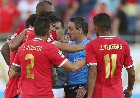 June 4, 2016 - Orlando, FL, USA - Costa Rica players surround a referee to argue a red card during action against Paraguay during the start of pool play in the Copa America at Camping World Stadium in Orlando, Fla., on Saturday, June 4, 2016. The teams tied, 0-0. Copa America: Costa Rica vs. Paraguay - ZUMAm67_