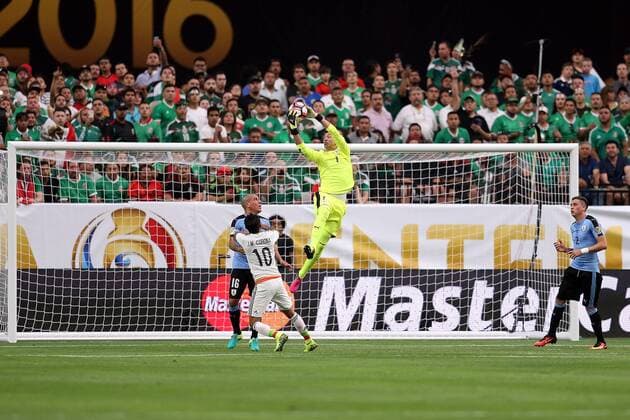 05 June 2016: Uruguay goalkeeper Fernando Muslera 1 makes a save over Mexico forward Jesus Manuel Corona 10 during the first half of the Copa America Centanario game at University of Phoenix Stadium in Glendale, Az. (Photo by Chris Coduto Icon Sportswire) SOCCER: JUN 05 Copa America Centenario - Mexico v Uruguay Icon3171606050652 EDITORIAL USE ONLY