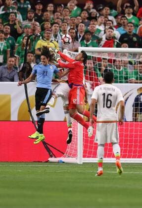 05 June 2016: Mexico goalkeeper Alfredo Talavera 12 makes a save over Uruguay forward Edinson Cavani 21 during the second half of the Copa America Centanario game at University of Phoenix Stadium in Glendale, Az. Mexico won 3-1. (Photo by Chris Coduto Icon Sportswire) SOCCER: JUN 05 Copa America Centenario - Mexico v Uruguay Icon3171606051202 EDITORIAL USE ONLY
