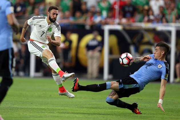 05 June 2016: Mexico defender Miguel Layun 7 shoots the ball over Uruguay defender Jose Gimenez 2 during the second half of the Copa America Centanario game at University of Phoenix Stadium in Glendale, Az. Mexico won 3-1. (Photo by Chris Coduto Icon Sportswire) SOCCER: JUN 05 Copa America Centenario - Mexico v Uruguay Icon3171606051341 EDITORIAL USE ONLY