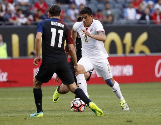 Copa America, USA - Costa Rica Costa Rica defender Johnny Acosta (R) moves the ball as United States midfielder Alejandro Bedoya defends during the first half of a 2016 Copa America Centenario Group A match at Soldier Field in Chicago on June 7, 2016. The United States defeated Costa Rica 4-0.  CHI2016060710 BRIANxKERSEY