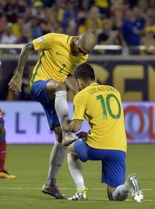 (160609) -- ORLANDO, June 9, 2016 -- Brazil s Dani Alves (L) celebrates with teammate Lucas Lima after scoring during the Copa America Centenario tournament Group B football match between Brazil and Haiti in Orlando, Florida, the United States, on June 8, 2016. Brazil won the match 7-1. ) (SP)U.S.-ORLANDO-COPA AMERICA-GROUP B-BRA VS HTI BaoxDandan 