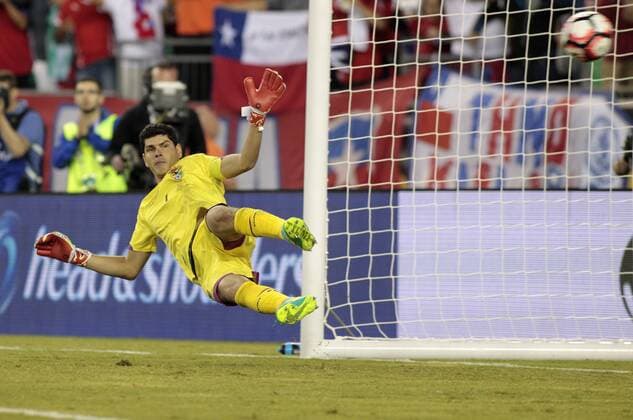 Bolivia goaltender Carlos Lampe gives up a goal to Chile midfielder Arturo Vidal (off camera) on a penalty kick in the second half of the Copa America Centenario Group D match at Gillette Stadium in Foxboro, Massachusetts on on June 10, 2016. Chile defeated Bolivia 2-1.  BOS2016061012 MATTHEWxHEALEY