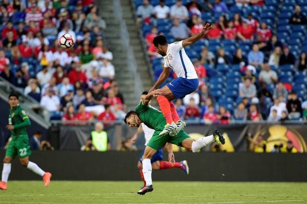 Friday, June 10, 2016: Chile defender Jean Beausejour (15) leaps over Bolivia midfielder Jhasmani Campos (10) during the Copa America Centenario soccer match between Chile and Bolivia Nationalteam Länderspiel held at Gillette Stadium in Foxborough, Massachusetts. SOCCER 2016: Copa America Centenario CHILE VS BOLIVIA Länderspiel Nationalmannschaft JUN 10 - ZUMAc04_