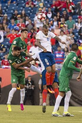June 10, 2016 - Foxborough, Massachusetts, U.S - Chile midfielder ARTURO VIDAL (8) heads the ball over Bolivia midfielder ALEJANDRO MELEAN (13) during the Copa America Centenario football tournament at Gillette Stadium in Foxborough, MA. Soccer 2016 - Copa America Centenario Uruguay vs. Venezuela - ZUMAs192