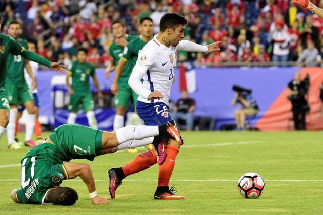 Friday, June 10, 2016: Bolivia defender Marvin Bejarano (17) flips onto his head trying to stop Chile forward Edson Puch (22) during the Copa America Centenario soccer match between Chile and Bolivia Nationalteam Länderspiel held at Gillette Stadium in Foxborough, Massachusetts. Chile defeats Bolivia 2-1 SOCCER 2016: Copa America Centenario CHILE VS BOLIVIA Länderspiel Nationalmannschaft JUN 10 - ZUMAc04_