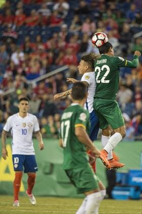 June 10, 2016 - Foxborough, Massachusetts, U.S - Bolivia defender EDWARD ZENTENO (22) heads the ball over Chile forward EDUARDO VARGAS (11) while Chile midfielder PABLO HERNANDEZ (10) & Bolivia defender MARVIN BEJARANO (17) look on during the Copa America Centenario football tournament at Gillette Stadium in Foxborough, MA. Soccer 2016 - Copa America Centenario Uruguay vs. Venezuela - ZUMAs192