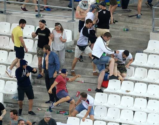 EURO 2016, Ausschreitungen auf der Tribüne beim Spiel England - Russland A woman try to flee as Russian fans confront England fans at the end of the match during the UEFA European Championship EM Europameisterschaft 2016 match at the Stade Velodrome, Marseille. Picture date June 11th, 2016 Pic David Klein Sportimage EDITORIAL USE ONLY. No use with unauthorised audio, video, data, fixture lists, club league logos or live services. Online in-match use limited to 120 images, no video emulation. No use in betting, games or single club league player publications.