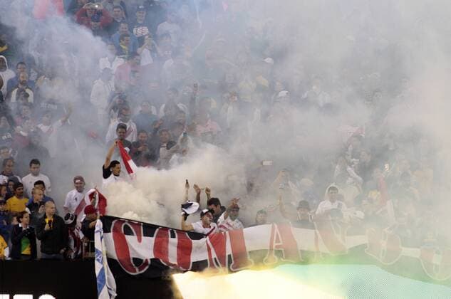 Peru fans set off a smoke grenade during the 2016 Copa America Centenario Group B match against Brazil at Gillette Stadium in Foxborough, Massachusetts on June 12, 2016.  BOS2016061205 MATTHEWxHEALEY