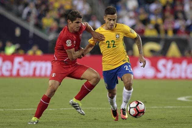 Peru defenseman Aldo Corzo (3) and Brazil midfielder Philippe Coutinho (22) tangle with each other in the first half of the 2016 Copa America Centenario Group B match at Gillette Stadium in Foxborough, Massachusetts on June 12, 2016.  BOS2016061209 MATTHEWxHEALEY