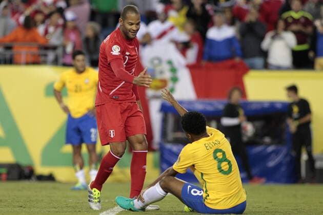 Peru defenseman Alberto Junior Rodriguez (2) shake hands with Brazil midfielder Elias after Peru defeated Brazil in the 2016 Copa America Centenario Group B match at Gillette Stadium in Foxborough, Massachusetts on June 12, 2016. Peru defeated Brazil 1-0.  BOS2016061213 MATTHEWxHEALEY