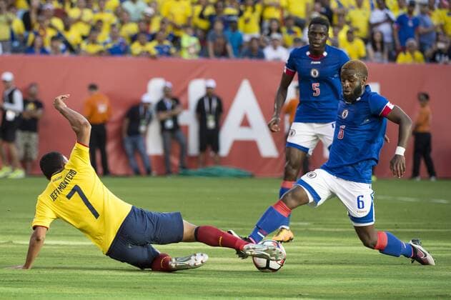 East Rutherford, New Jersey, U.S - Ecuador midfielder JEFFERSON MONTERO (7) slides in on Haiti defender STEPHANE LAMBESE (6) while Haiti defender ROMAIN GENEVOIS (5) looks on during the Copa America Centenario USA 2016 soccer tournament at MetLife Stadium in East Rutherford, NJ Soccer 2016 - Copa America Centenario Ecuador vs. Haiti 4-0 - ZUMAs192
