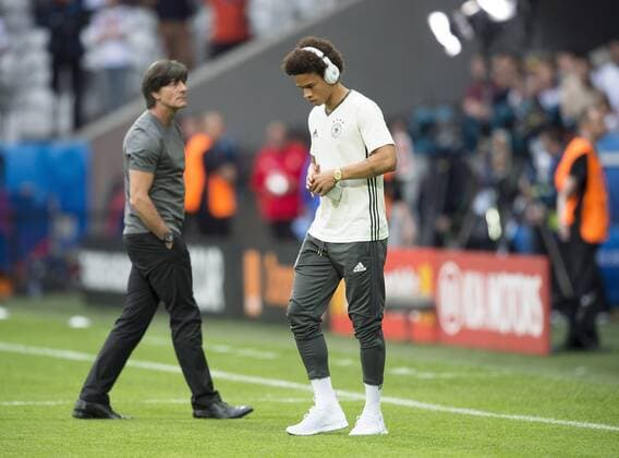 Leroy SANE (GER) mit Kopfhoerer, vor dem SPiel, im Hintergrund Trainer Bundestrainer Joachim Jogi LOEW (LÖW) (GER) Vorrunde Gruppe C, Spiel M07, Deutschland (GER) - Ukraine (UKR) 2:0, am 12.06.2016 in Lille. Fussball EM 2016 in Frankreich vom 10.06. - 10.07.2016.