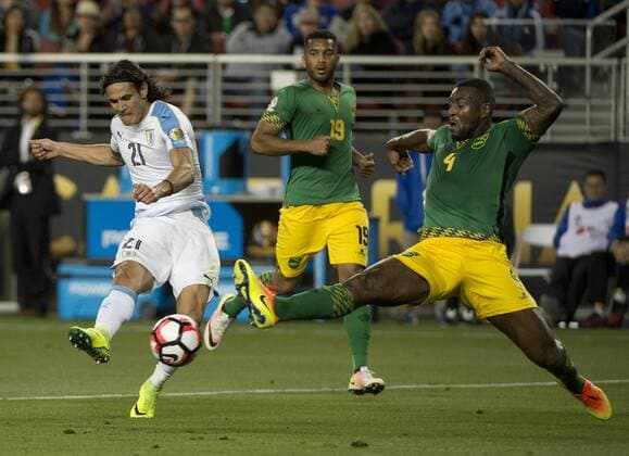 Uruguay s Edinson Cavani (21) shoots as Jamaica s Westley Morgan (4) extends to intercept in the second half at COPA America Centenario at Levi s Stadium in Santa Clara, California on June 13, 2016. Uruguay won 3-0.  SXP2016061319 TERRYxSCHMITT