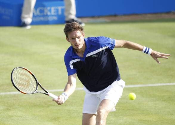 14.06.2016. Queens Club, London, England. Aegon Queens Tennis Championships Day Two. Nicolas Mahut (FRA) forehand volley in his 1st round match against Andy Murray (GBR). xAlanxMartinx  ActionPlus11749100