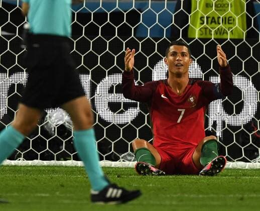 Cristiano Ronaldo of Portugal reacts during the Euro 2016 Group F soccer match between Portugal and Iceland in Saint-Etienne, France, June 14, 2016. The match ended with a 1-1 draw. ) (SP)FRANCE-SAINT-ETIENNE-SOCCER-EURO 2016-GROUP F-PORTUGAL VS ICELAND GuoxYong 