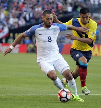 USA s Clint Dempsey (8) fends off Ecuador s Juan Carlos Paredes (5) in a 2016 Copa America Centenario soccer quarterfinals at CenturyLink Field in Seattle, Washington on June 16, 2016. Dempsey scored a first half goal in the USA 2-1 win over Ecuador to advance to the semi-finals.  SEA2016061603 JIMxBRYANT