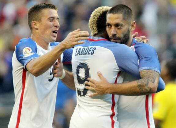 USA s Clint Dempsey, right, and Matt Besler (5) rushes in to hug Gyasi Zardes (9) after he scored a goal against Ecuador in a 2016 Copa America Centenario soccer quarterfinals at CenturyLink Field in Seattle, Washington on June 16, 2016. USA beats Ecuador 2-1 to advance to semi-finals  SEA2016061614 JIMxBRYANT