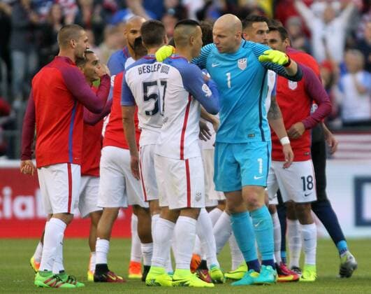 USA goalie Brad Guzan (1) hugs teammate Bobby Wood (7) after their 2-1 win over Ecuador in a 2016 Copa America Centenario soccer quarterfinals at CenturyLink Field in Seattle, Washington on June 16, 2016. USA beats Ecuador 2-1 to advance to the semi-finals.  SEA2016061620 JIMxBRYANT