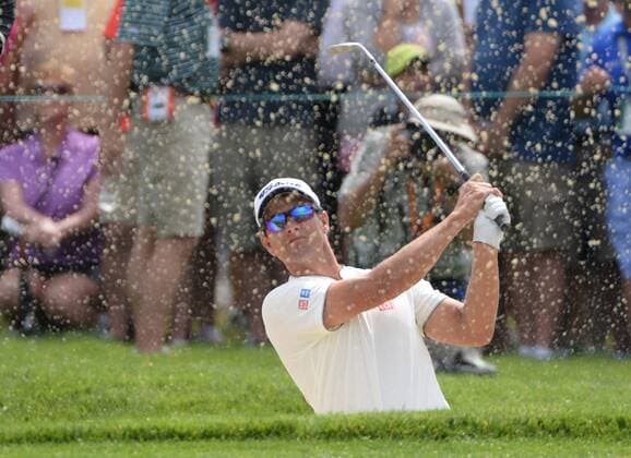 Adam Scott of Australia hits from a sand trap on the fourth hole of his first round during the Friday round of the U.S. Open golf championship at Oakmont Country Club near Pittsburgh, Pennsylvania on June 17, 2016. Scott was just starting his first round due to the rain delays yesterday and will play his second 18 later today.  OAK20160617106 PATxBENIC