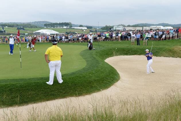 KT Kim, of South Korea, hits out of the sand trap on the second hole of his first round during the second day of the U.S. Open golf championship at Oakmont Country Club near Pittsburgh, Pennsylvania on June 17, 2016. Kim was just starting his first round due to the rain delays on Thursday.  OAK20160617112 PATxBENIC