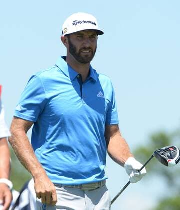 Dustin Johnson walks after hitting his drive on the 18th hole of his first round during the Friday round of the U.S. Open golf championship at Oakmont Country Club near Pittsburgh, Pennsylvania on June 17, 2016. Johnson finished at three under par, one back after the first round, which was delayed because of rain yesterday. Johnson will play his second round later in the day.  OAK20160617123 PATxBENIC