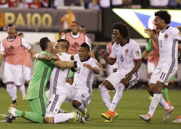 Colombia goalie David Ospina celebrates with Dayro Moreno after their victory at the Copa America Centenario USA 2016 quarter-finals at MetLife Stadium in East Rutherford, New Jersey on June 17, 2016. Colombia defeated Peru 0-0 and 4-2 on penalties.  NYP20160617138 JOHNxANGELILLO