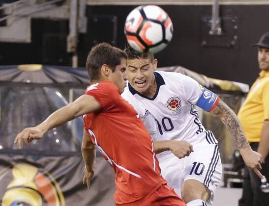 James Rodriguez of Colombia and Aldo Corzo of Peru battle for possession of the ball at the Copa America Centenario USA 2016 quarter-finals at MetLife Stadium in East Rutherford, New Jersey on June 17, 2016. Colombia defeated Peru 0-0 and 4-2 on penalties.  NYP20160617146 JOHNxANGELILLO