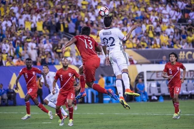 June 17, 2016 - East Rutherford, New Jersey, U.S - Colombia forward MURILLO (22) heads the ball over Peru midfielder RENATO TAPIA (13) during the Copa America Centenario USA 2016 soccer tournament at MetLife Stadium in East Rutherford, NJ Soccer 2016 - Copa America Centenario Colombia vs. Peru 0-0 (4-2) - ZUMAs192
