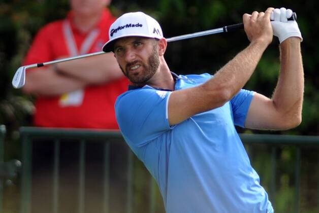 Dustin Johnson watches as his tee shot on the second hole goes far left during the third round at the U.S. Open golf championship at Oakmont Country Club near Pittsburgh, on June 18, 2016.  OAK20160618320 ARCHIExCARPENTER
