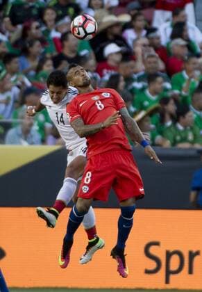 Chile s Arturo Vidal (8) and Mexico s Chicarito (14) leap for the ball in the first half at COPA America Centenario quarter-finals at Levi s Stadium in Santa Clara, California on June 18, 2016. Chile annihilated Mexico 7-0.  SXP2016061801 TERRYxSCHMITT