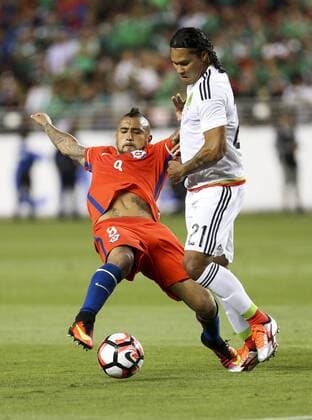 June 18, 2016 - Los Angeles, California, U.S - Chile midfielder Arturo Vidal 8 vies the ball against Mexico midfielder Carlos Pena 21 in the Copa America soccer match between Mexico and Chile at the LeviÃ s Stadium in Santa Clara, California, June 18, 2016. Chile won 7-0. Copa America 2016 Quarterfinal Chile defeats Mexico 7-0 - ZUMAc68_