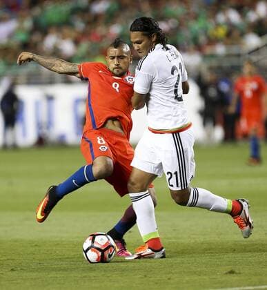 June 18, 2016 - Los Angeles, California, U.S - Chile midfielder Arturo Vidal 8 vies the ball against Mexico midfielder Carlos Pena 21 in the Copa America soccer match between Mexico and Chile at the LeviÃ s Stadium in Santa Clara, California, June 18, 2016. Chile won 7-0. Copa America 2016 Quarterfinal Chile defeats Mexico 7-0 - ZUMAc68_