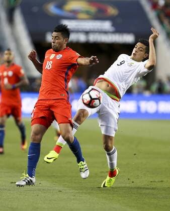 June 18, 2016 - Los Angeles, California, U.S - Chile defender Gonzalo Jara 18 vies the ball against Mexico forward Raul Jimenez 9 in the Copa America soccer match between Mexico and Chile at the LeviÃ s Stadium in Santa Clara, California, June 18, 2016. Chile won 7-0. Copa America 2016 Quarterfinal Chile defeats Mexico 7-0 - ZUMAc68_